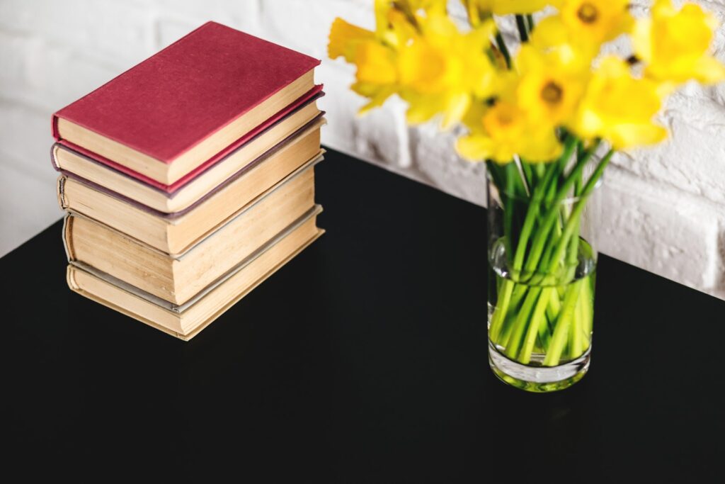 eliminate negativity from your life - Hardbound Books Beside Yellow Petaled Flowers