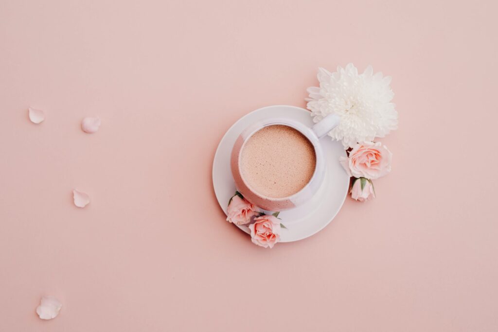 white cup with saucer on pink surface - how to feel fulfilled