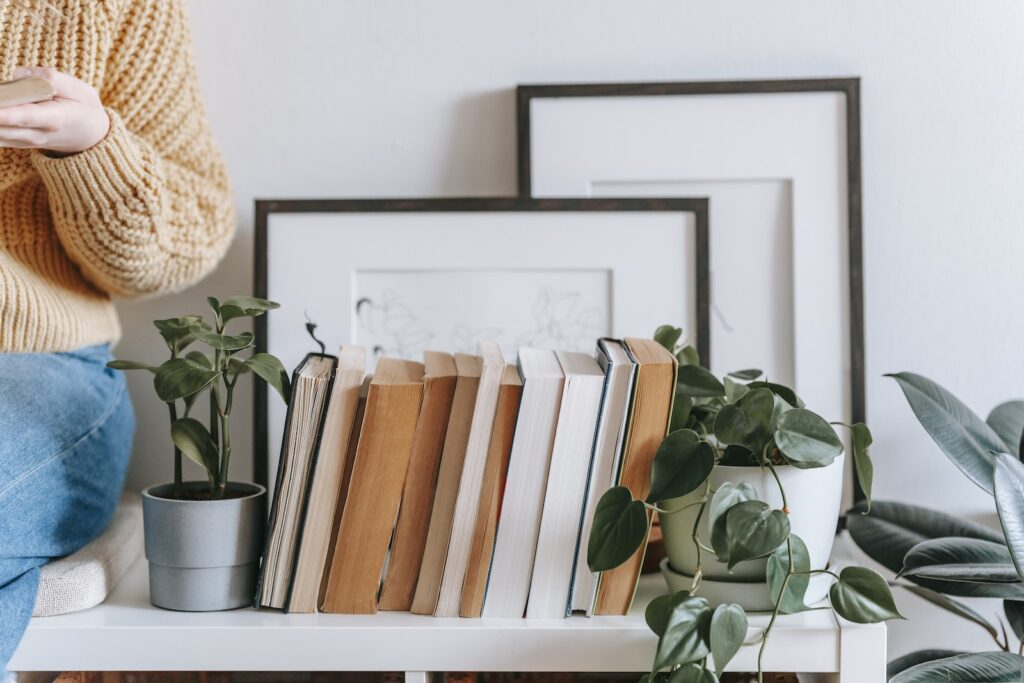 organized books and plants on table - get your life back on track